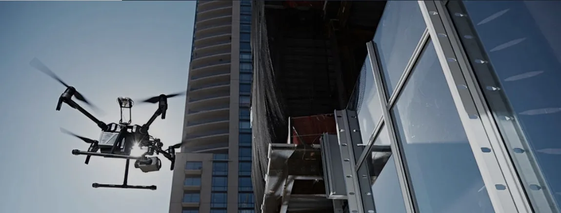 Drone capturing imagery of a high-rise building